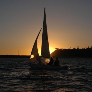 Tradewinds Literary Magazine photo of sailboat at sunset